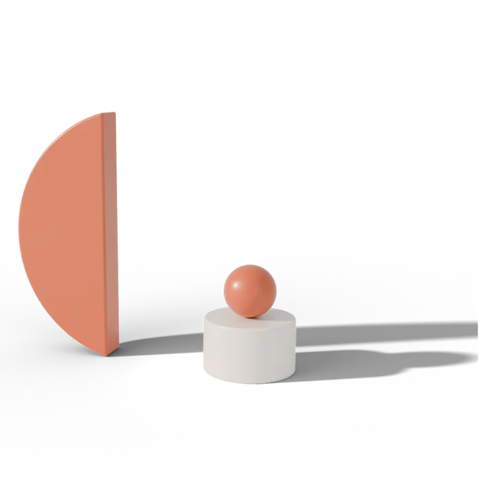One terracotta half standing alone, the ball waiting on a white plinth